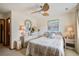 Cozy bedroom featuring a ceiling fan, coastal decor, and comfortable furnishings at 7000 Palmetto Dr # 5A, Isle of Palms, SC 29451