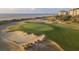 Picturesque golf course with a sand bunker and ocean views, perfect for golf enthusiasts at 7000 Palmetto Dr # 5A, Isle of Palms, SC 29451