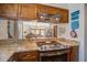 Stylish kitchen with stainless steel appliances, granite countertops, and wooden cabinets open to living area at 7000 Palmetto Dr # 5A, Isle of Palms, SC 29451