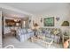 Inviting living room with comfortable striped sofas, a coffee table, and an adjacent dining area at 7000 Palmetto Dr # 5A, Isle of Palms, SC 29451