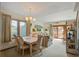 Cozy living room and dining area with seaside decor and a sunny sliding door to the deck at 7000 Palmetto Dr # 5A, Isle of Palms, SC 29451