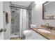 Bathroom featuring marble-style tile shower, marble vanity and modern fixtures at 851 Sandlake Dr # F, Mount Pleasant, SC 29464