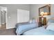 Bedroom featuring two twin beds, neutral walls, vaulted ceiling, and view of closet at 851 Sandlake Dr # F, Mount Pleasant, SC 29464
