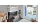 Cozy fireplace with black grate and sliding glass doors leading to outdoor area at 851 Sandlake Dr # F, Mount Pleasant, SC 29464