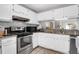 Bright kitchen with stainless steel appliances, white cabinets, and granite countertops at 851 Sandlake Dr # F, Mount Pleasant, SC 29464