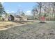 A well-maintained backyard with a storage shed, offering plenty of space for gardening and outdoor enjoyment at 105 Alan Ct, Summerville, SC 29485