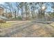 An expansive, fenced backyard with a shed provides ample space for outdoor activities and relaxation in a serene setting at 105 Alan Ct, Summerville, SC 29485