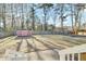 A large, well-maintained backyard with a shed surrounded by mature trees providing ample space for outdoor activities at 105 Alan Ct, Summerville, SC 29485