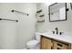Modern bathroom with a wooden vanity, stone countertop, open shelves, and minimalist design at 105 Alan Ct, Summerville, SC 29485