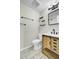 Modern bathroom with a wooden vanity, stone countertop, open shelves, and minimalist design at 105 Alan Ct, Summerville, SC 29485