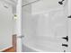 A clean, white bathroom with a shower and tub combination for relaxing baths and convenient showers at 105 Alan Ct, Summerville, SC 29485