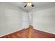 Bedroom featuring hardwood floors, a ceiling fan, and doors to the closet and bathroom at 105 Alan Ct, Summerville, SC 29485
