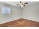 A bright, empty bedroom showcases hardwood floors, and a ceiling fan at 105 Alan Ct, Summerville, SC 29485