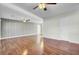 A spacious living room showcasing beautiful wood floors, ceiling fans, and neutral-toned walls at 105 Alan Ct, Summerville, SC 29485