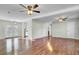 Spacious living room with hardwood floors, ample natural light, and seamless flow to the kitchen and outdoor spaces at 105 Alan Ct, Summerville, SC 29485
