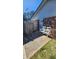 Back patio area with chairs, gate and brick home at 105 Ford Ct, Summerville, SC 29483