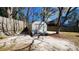 Backyard featuring a storage shed, mature trees and a wooden fence at 105 Ford Ct, Summerville, SC 29483