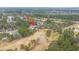 A nice aerial view of a residential area and golf course featuring mature trees, manicured fairways, and traditional-style homes at 105 Pine Valley Dr, Summerville, SC 29483