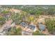 Bird's eye view of homes nestled on a golf course, featuring mature trees, water, and lush landscape at 105 Pine Valley Dr, Summerville, SC 29483