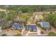 Beautiful aerial view of homes on a golf course, featuring mature landscaping, serene ponds, and a lush green at 105 Pine Valley Dr, Summerville, SC 29483