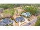 Stunning aerial shot of houses on a golf course, highlighting mature landscaping, water features, and greenery at 105 Pine Valley Dr, Summerville, SC 29483