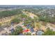 An aerial view of a residential area that features mature landscaping, and houses that are located on a golf course at 105 Pine Valley Dr, Summerville, SC 29483