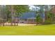 The backyard of this brick home features a large stone patio perfect for outdoor relaxation and entertainment at 105 Pine Valley Dr, Summerville, SC 29483