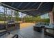 Backyard scene with covered outdoor kitchen area and lounging sectional, perfect for outdoor relaxation and dining at 105 Pine Valley Dr, Summerville, SC 29483
