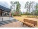 Landscaped backyard features a brick patio with seating and a manicured lawn, perfect for relaxation and enjoyment at 105 Pine Valley Dr, Summerville, SC 29483