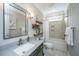 Modern bathroom with sleek vanity, stylish mirror, and a shower-tub combination at 105 Pine Valley Dr, Summerville, SC 29483