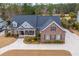 A beautiful brick home with a well manicured lawn and circular drive offers great curb appeal at 105 Pine Valley Dr, Summerville, SC 29483