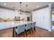 Bright kitchen featuring a large island with seating, white cabinetry, and stainless appliances at 105 Pine Valley Dr, Summerville, SC 29483