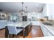 Kitchen features an island with seating, stainless appliances, and white cabinetry for a modern design at 105 Pine Valley Dr, Summerville, SC 29483