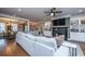 A comfortable living room with a fireplace, built-in shelves, and view into the dining area at 105 Pine Valley Dr, Summerville, SC 29483