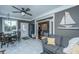 Open living area with tile floors, a ceiling fan, comfortable seating, and a view into another room at 105 Pine Valley Dr, Summerville, SC 29483