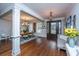 This open-concept living area features hardwood flooring, ornate door, and seamless transition to the dining area at 105 Pine Valley Dr, Summerville, SC 29483