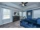 Bedroom with a striking blue accent wall, complemented by neutral tones and ample natural light at 105 Pine Valley Dr, Summerville, SC 29483