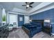 Bedroom with a tray ceiling, textured wallpaper, and bright windows, with a dark wood bedroom set at 105 Pine Valley Dr, Summerville, SC 29483