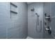 Modern shower features sleek gray tiling, built-in shelves, and contemporary fixtures and fixtures at 105 Pine Valley Dr, Summerville, SC 29483