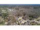 This aerial shot showcases a neighborhood with a pool in the backyard at 109 Arbor Oaks Dr, Summerville, SC 29485