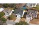 Aerial view shows houses on a tree lined street, one with a pool at 109 Arbor Oaks Dr, Summerville, SC 29485