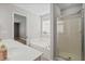 Bathroom featuring a soaking tub, glass enclosed shower, and double sinks at 109 Arbor Oaks Dr, Summerville, SC 29485