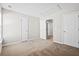 Spacious carpeted bedroom with multiple closets and doors creating a flexible space at 109 Arbor Oaks Dr, Summerville, SC 29485