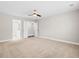 Bedroom featuring neutral carpet, ceiling fan, and ensuite bathroom with double doors at 109 Arbor Oaks Dr, Summerville, SC 29485