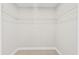 Walk-in closet with white shelving and neutral carpet at 109 Arbor Oaks Dr, Summerville, SC 29485