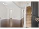 Inviting entryway featuring dark hardwood floors, staircase, and modern lighting at 109 Arbor Oaks Dr, Summerville, SC 29485