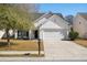 Charming home featuring a white facade, well-maintained lawn, and attached two-car garage at 109 Arbor Oaks Dr, Summerville, SC 29485