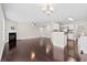 Spacious living room with fireplace, hardwood floors, and open layout to the kitchen at 109 Arbor Oaks Dr, Summerville, SC 29485