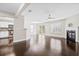 Open-concept living room with fireplace, dark wood floors, and sliding glass doors to the backyard at 109 Arbor Oaks Dr, Summerville, SC 29485