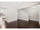 Open living space featuring dark hardwood floors, neutral walls, and staircase at 109 Arbor Oaks Dr, Summerville, SC 29485